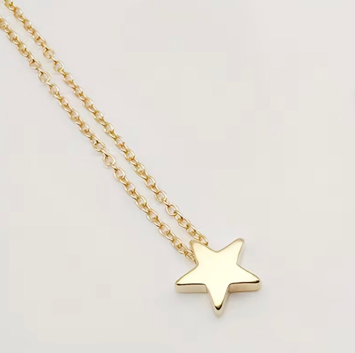 Collar de estrella dorado